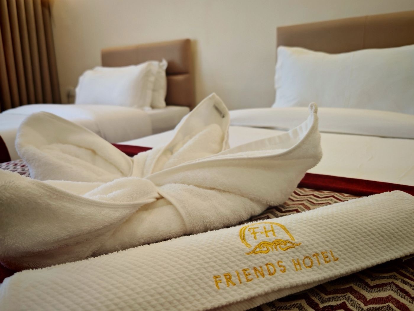 Friends Hotel twin room with branded towels